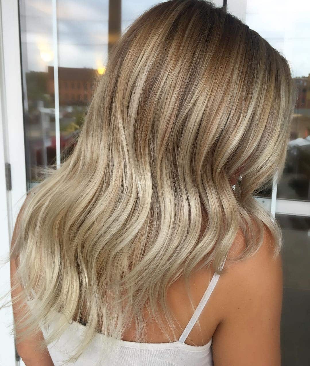 9. Soft Beach Feather Waves in Beige Blonde - Feather Haircuts For Women