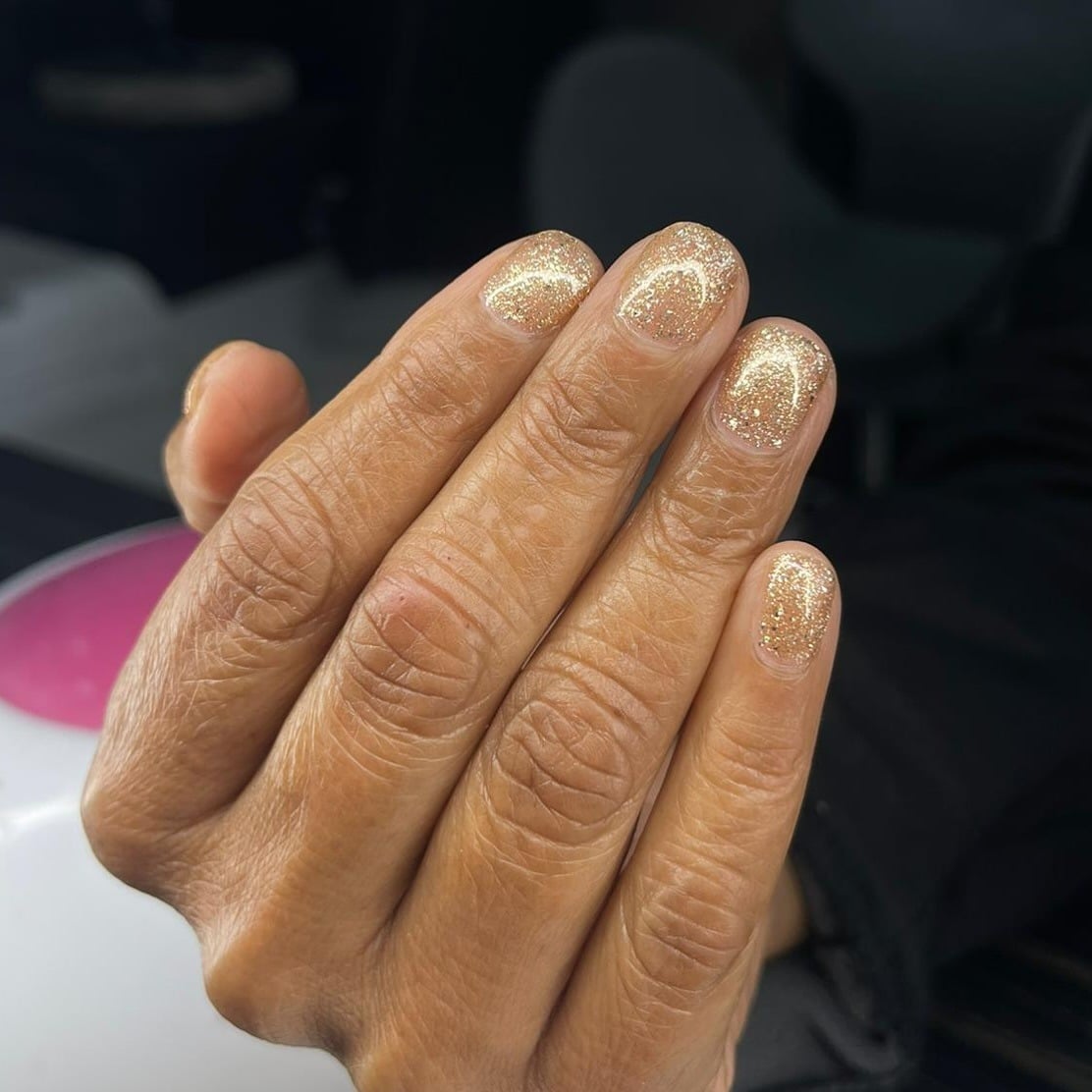 19. Champagne Gold Glitter Short Nails - glitter sparkle nail ideas