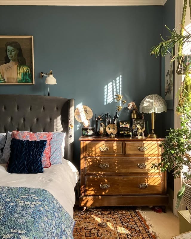 15. Moody Blue Vintage Bedroom with Antique Wood Furniture - vintage bedroom ideas
