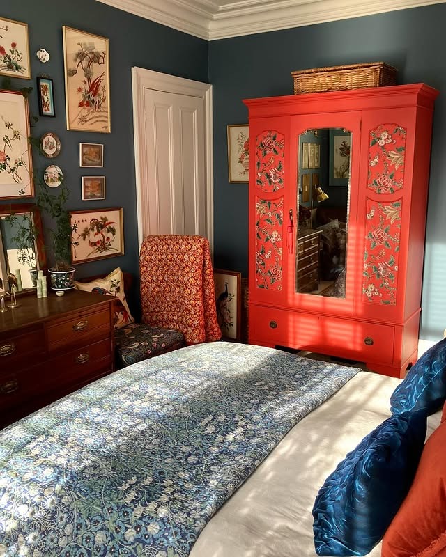 17. Navy and Red Vintage Bedroom with Painted Armoire - vintage bedroom ideas