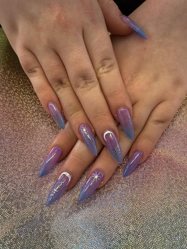 2. Lavender Galaxy Stiletto Nails - winter nail ideas