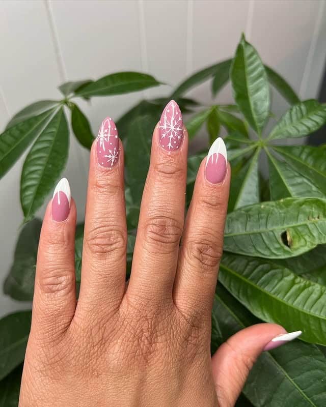 13. Pink Snowflake French Almond Nails - winter nail ideas