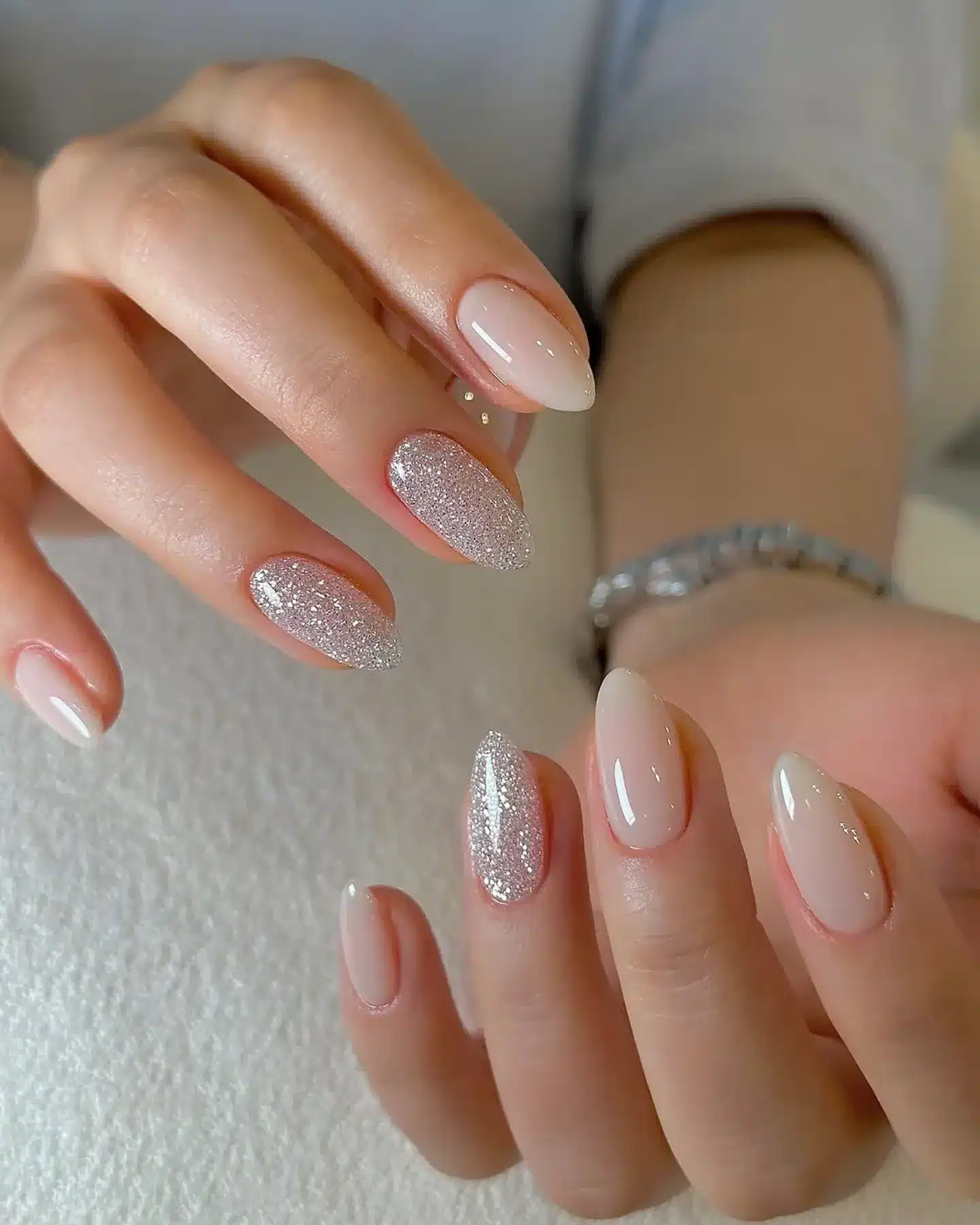 3. Milky Nude Almond Nails with Silver Glitter Accent - nail ideas for work