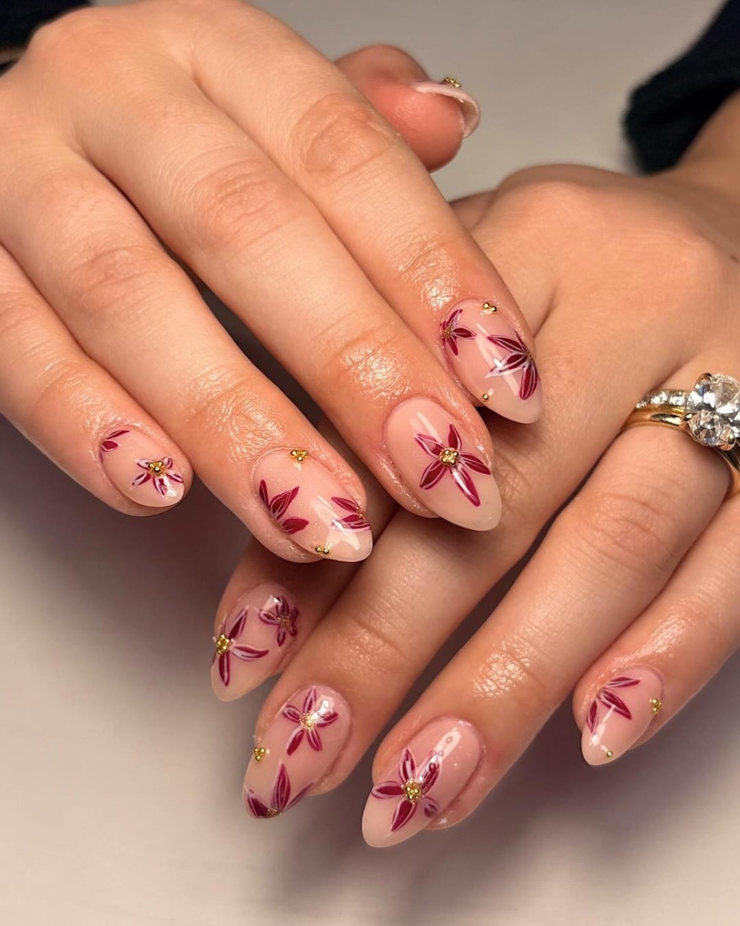 15. Burgundy Floral Almond Nails with Gold Stud Details - nail ideas for work