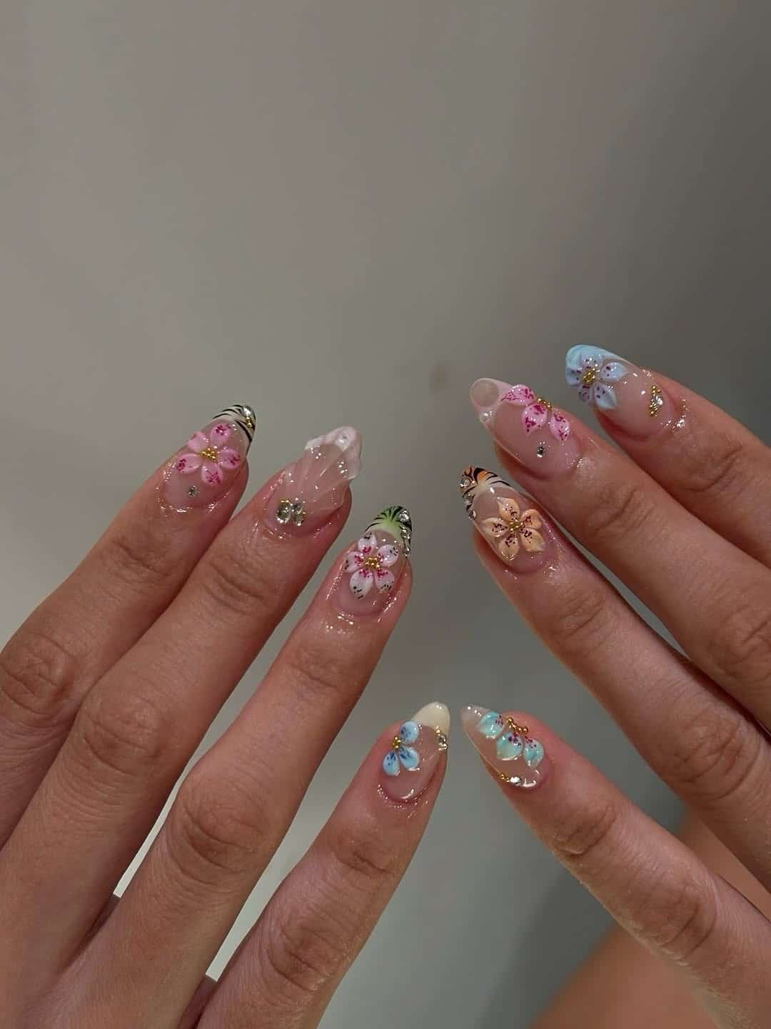 18. 3D Pastel Floral Almond Nails with Gold Accents - nail ideas for work
