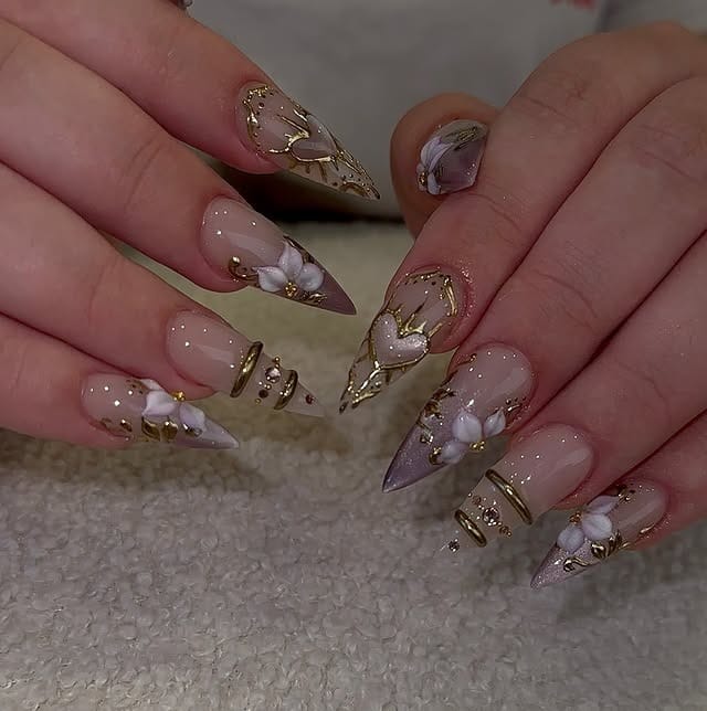 19. Nude Chrome Stiletto Nails with White Floral Embellishments - nail ideas for work