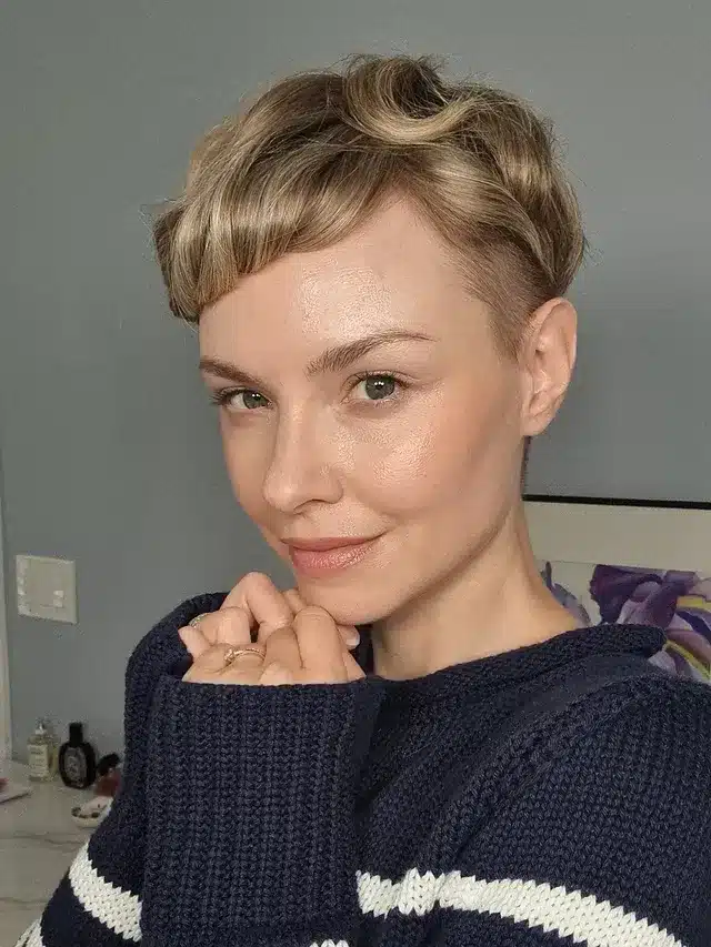 8. Vintage Blonde Pixie with Curled Bangs - Pixie Hairstyles With Bangs