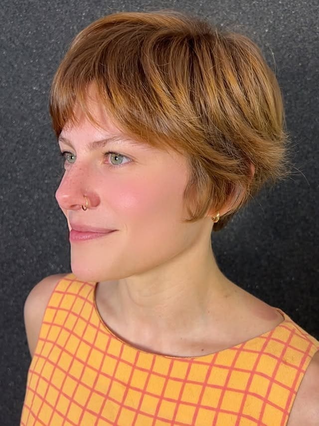 9. Ginger Pixie Bob with Rounded Bangs - Pixie Hairstyles With Bangs