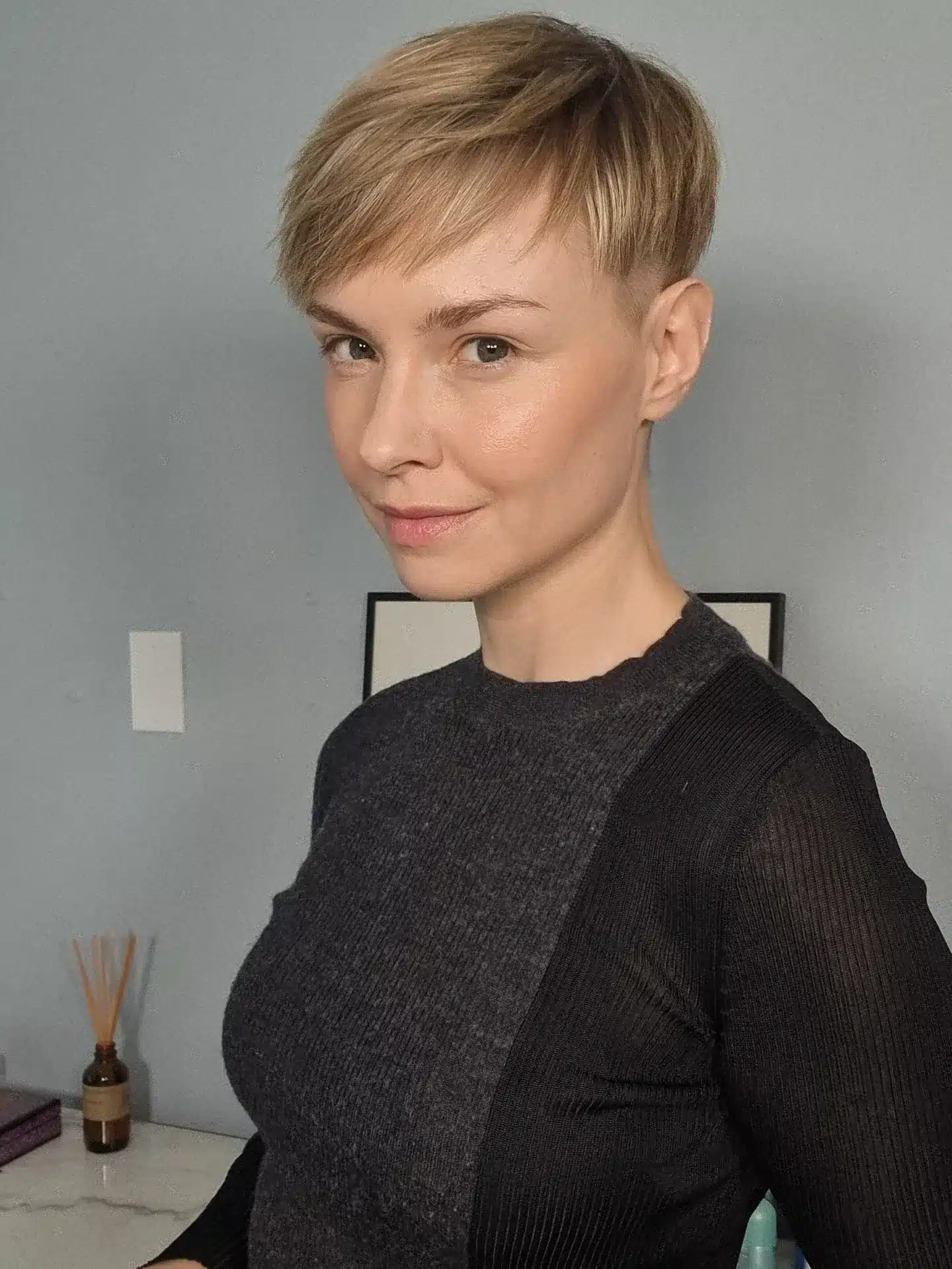 11. Ash Blonde Side-Swept Pixie with Long Bangs - Pixie Hairstyles With Bangs