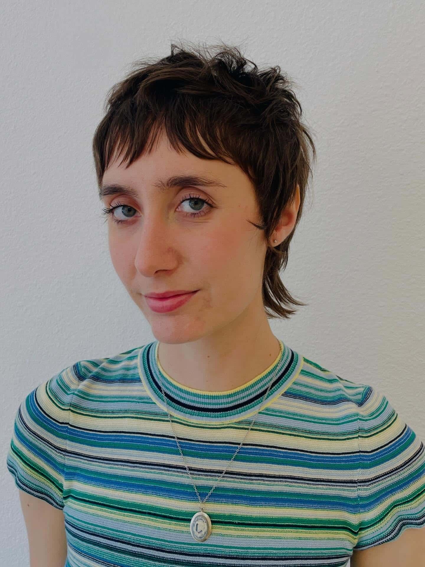 14. Soft Black Mullet Pixie with Piecey Bangs - Pixie Hairstyles With Bangs