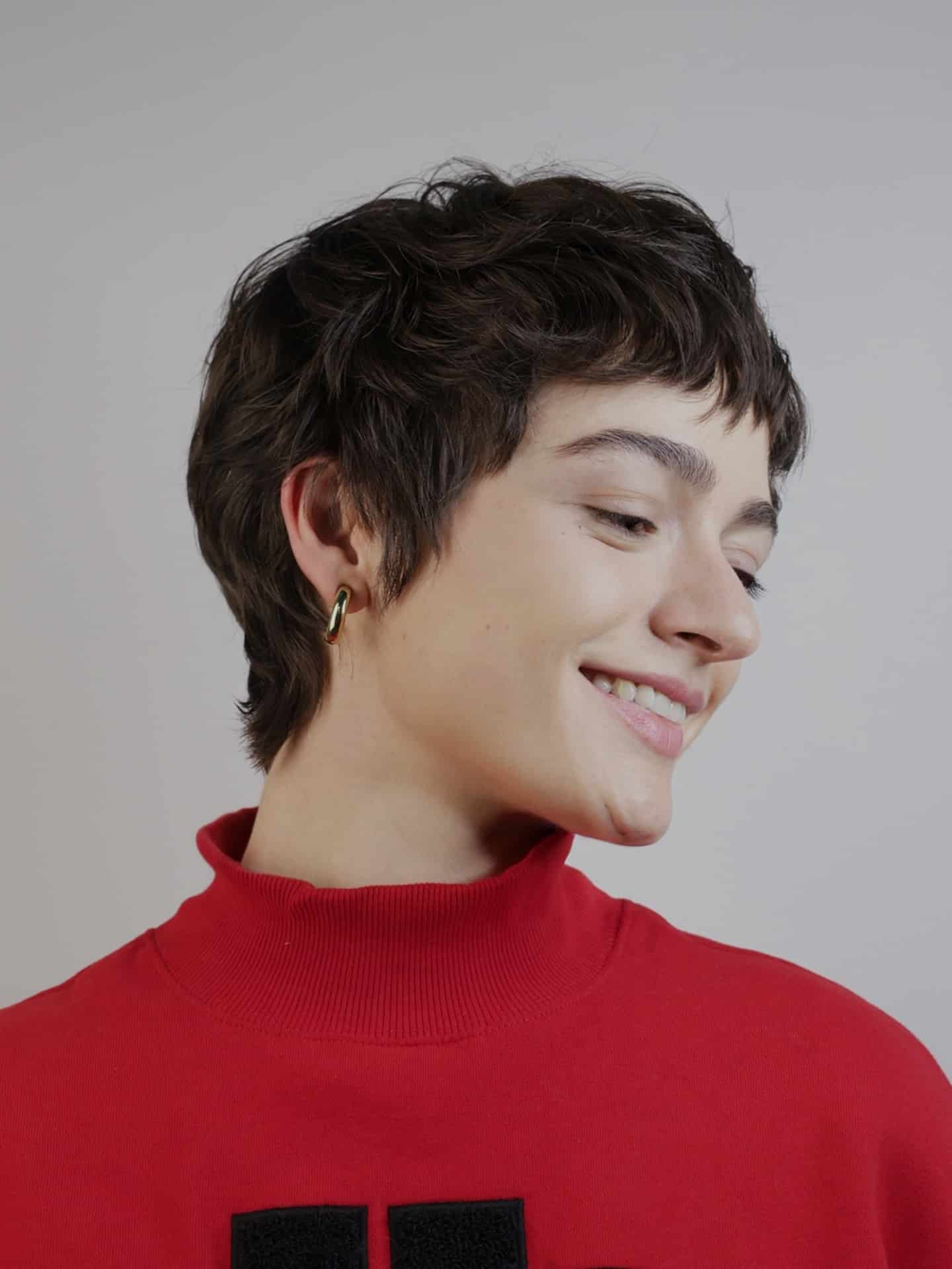 17. Layered Brunette Pixie with Short Feathered Bangs - Pixie Hairstyles With Bangs