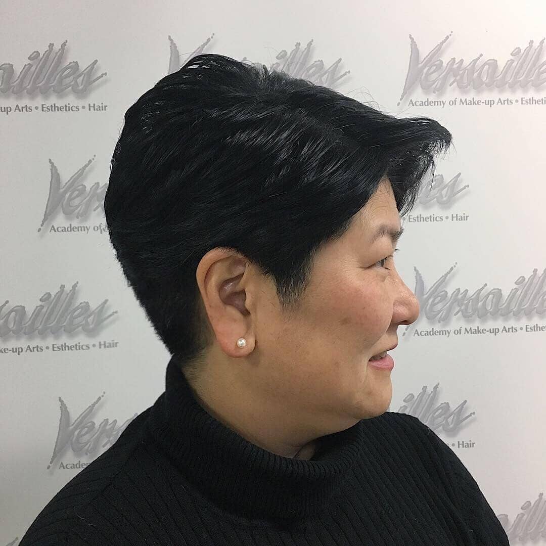 15. Sleek Jet Black Tapered Pixie - Short Tapered Haircut