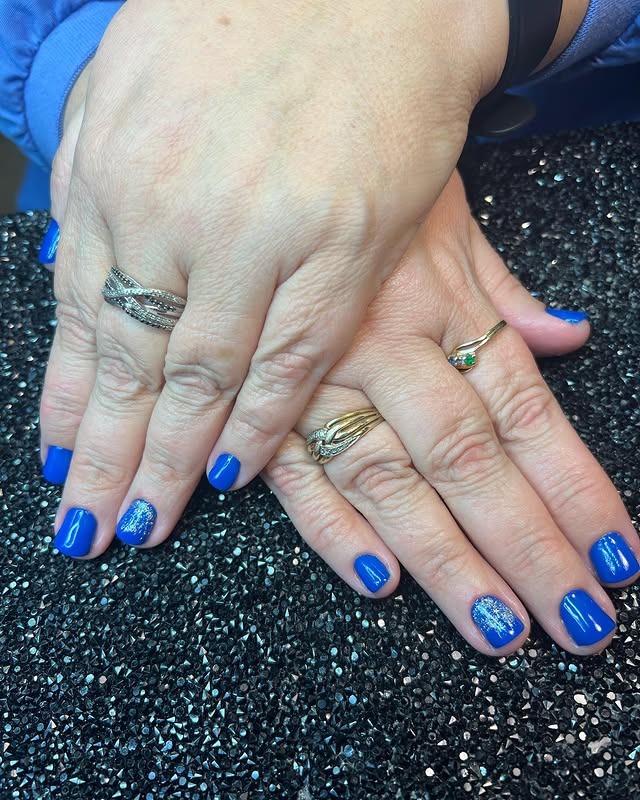 8. Electric Blue Glitter Accent Nails - solid nail color ideas 