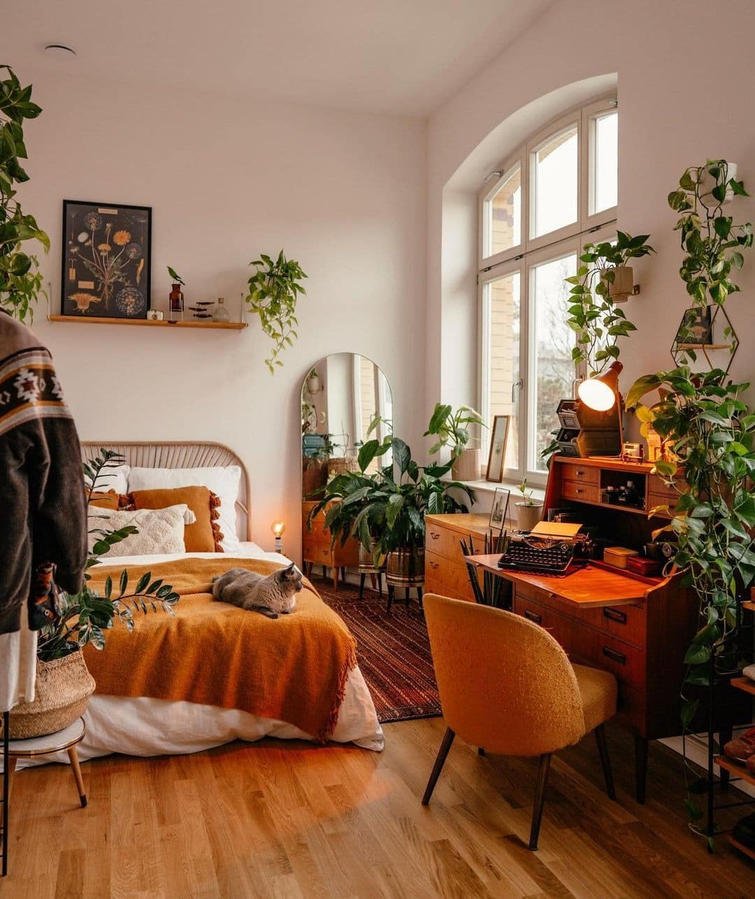 4. Botanical Burnt Orange Boho Bedroom - burnt orange bedroom ideas