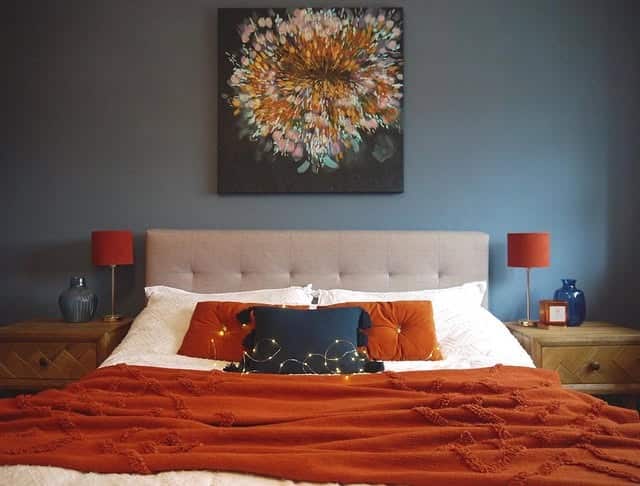 10. Burnt Orange and Navy Moody Bedroom - burnt orange bedroom ideas