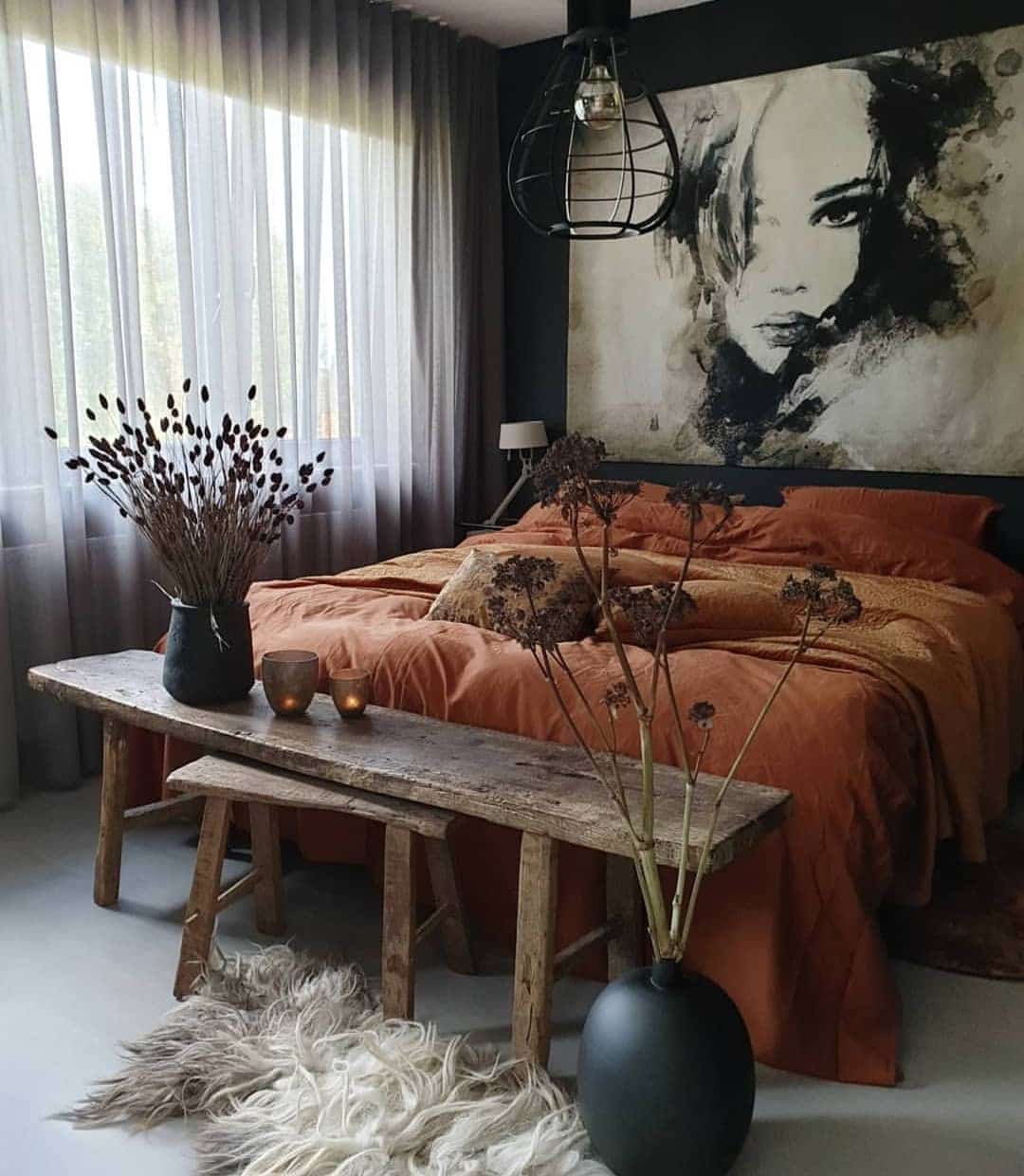 13. Moody Burnt Orange Bedroom with Black Accents - burnt orange bedroom ideas
