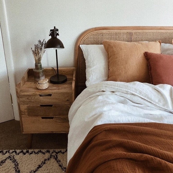 16. Earthy Burnt Orange and Cane Bedroom - burnt orange bedroom ideas