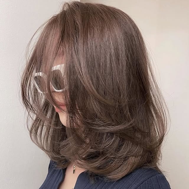 5. Smoky Mocha Layered Blowout with Wispy Curtain Fringe - Medium Wispy Haircuts