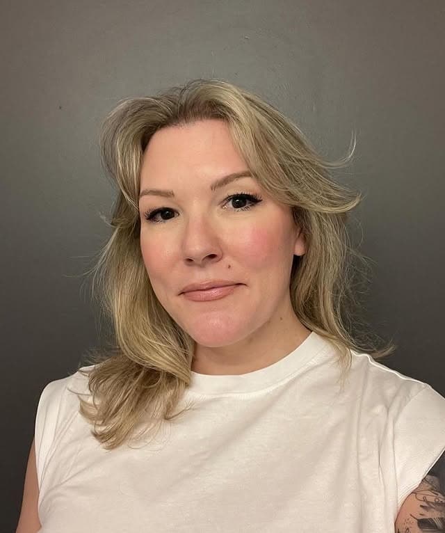 17. Ash Blonde Feathered Layers with Curtain Styling - Medium Wispy Haircuts