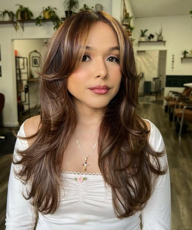 19. Mocha Brown Long Layers with Face-Framing Curtain Bangs - Medium Wispy Haircuts