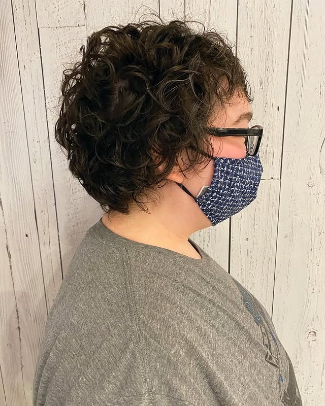 9. Dark Mocha Curly Pixie with Soft Fringe - Curly Pixie Hairstyles