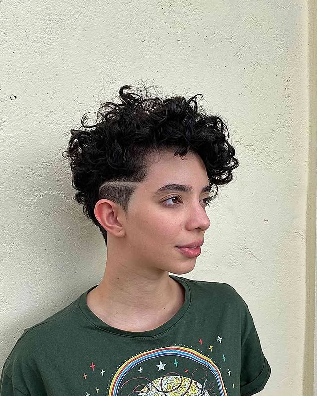 22. Jet Black Curly Pixie Undercut with Shaved Detail - Curly Pixie Hairstyles