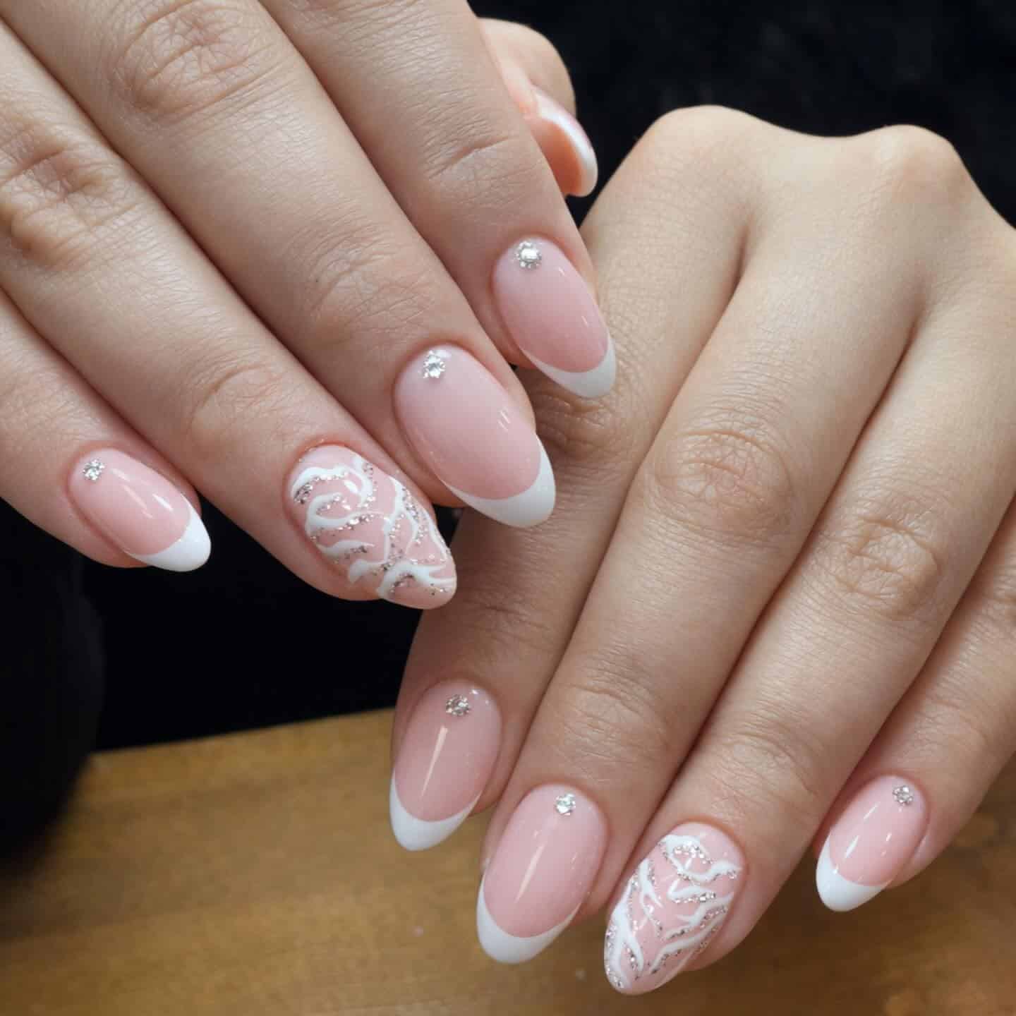 3. Classic White French Almond Nails with Lace Art - almond nail ideas