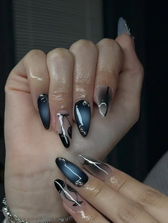 7. Smoky Black Ombre Almond Nails - almond nail ideas