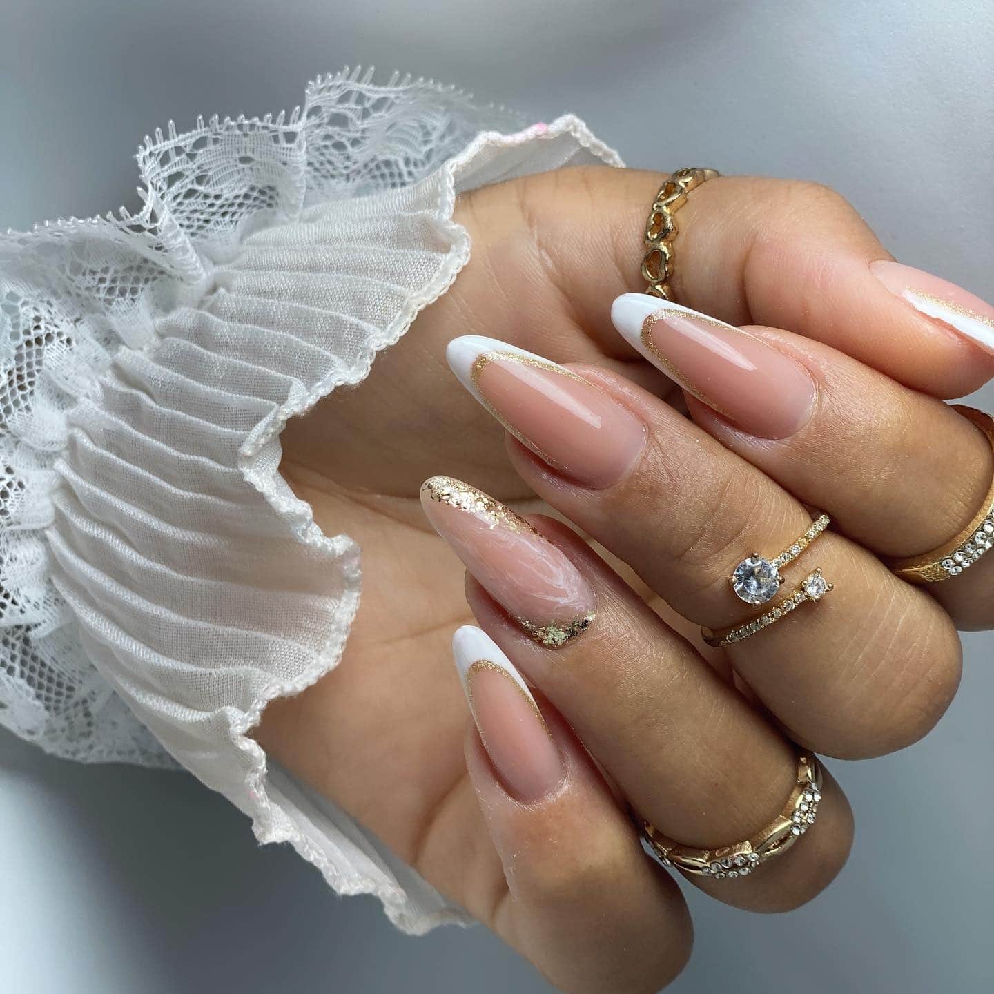 20. Classic White French Almond Nails with Gold Glitter - almond nail ideas