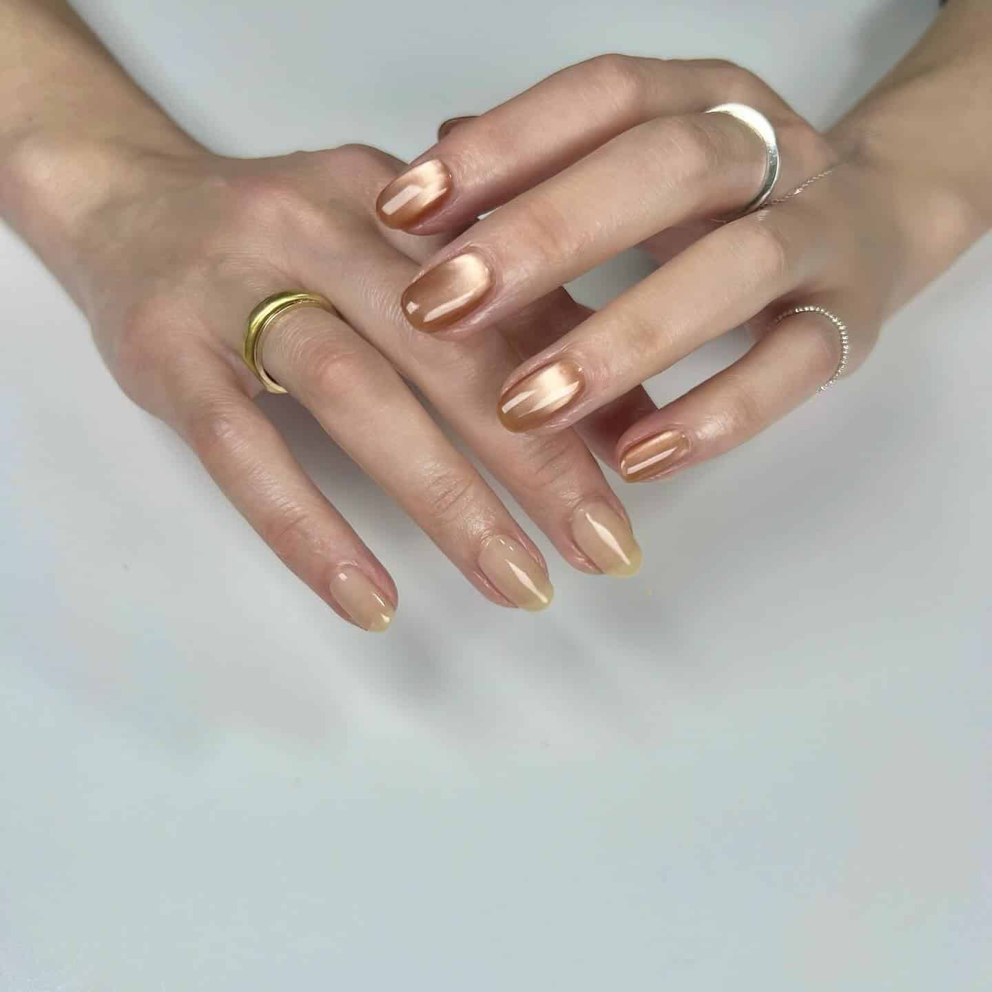 3. Bronze Chrome Almond Nails - office nail ideas