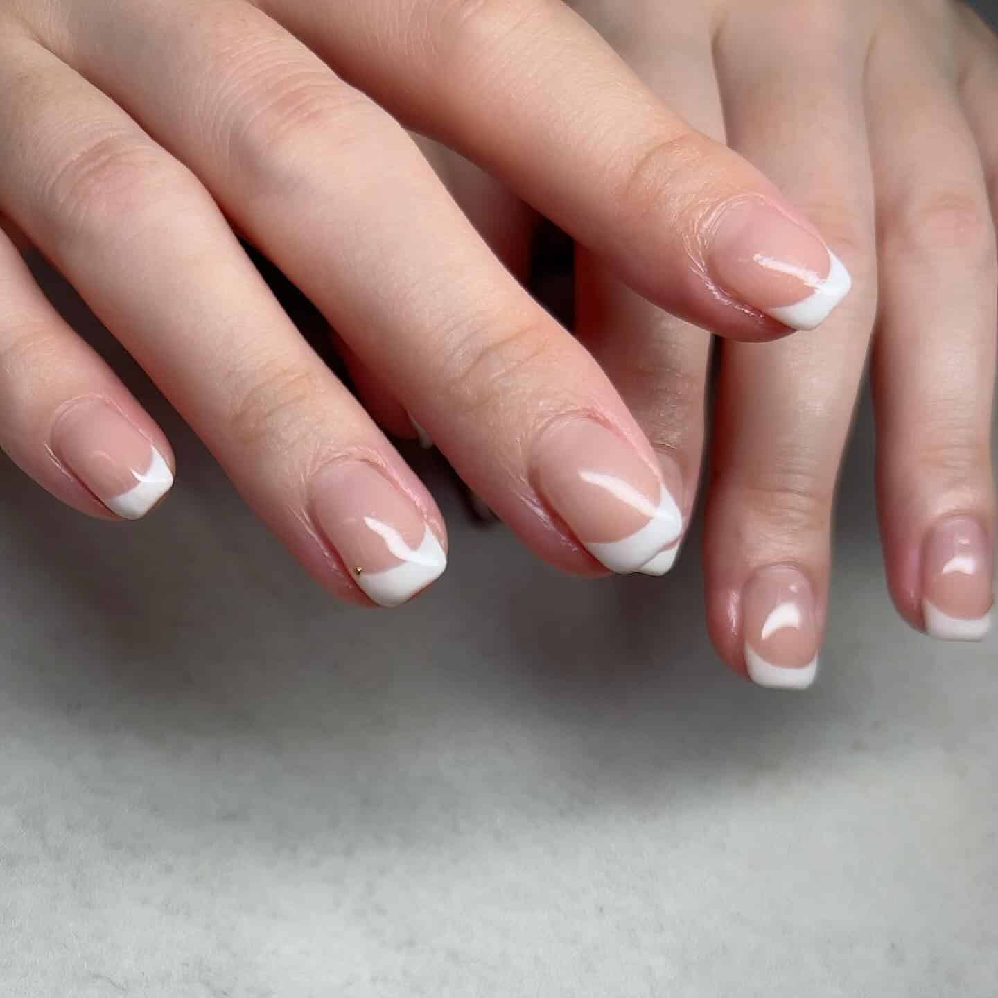 17. Modern Curved French Tip Nails - office nail ideas