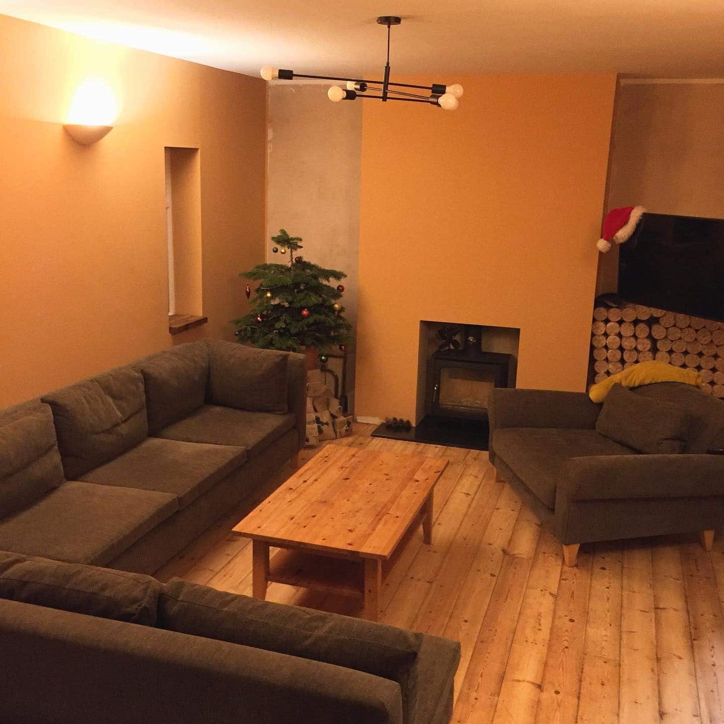 13. Warm Apricot Living Room with Minimalist Scandinavian Styling - orange living room ideas