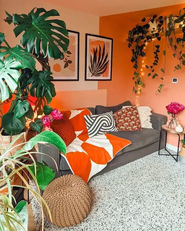 18. Peach and Orange Living Room with Botanical Decor - orange living room ideas