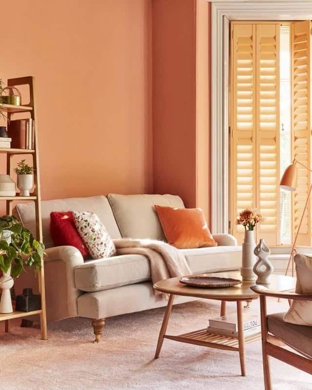 21. Soft Peach Orange Living Room with Scandinavian Warmth - orange living room ideas