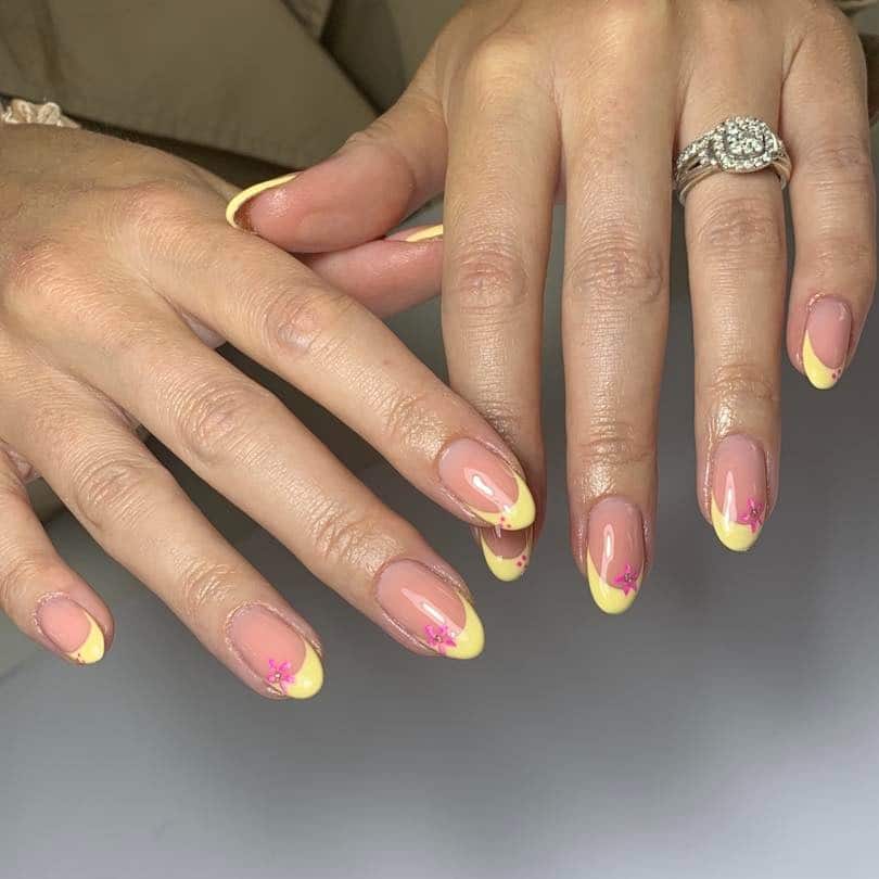 4. Yellow French Tip Oval Nails with Pink Floral Details - yellow french tip nail ideas