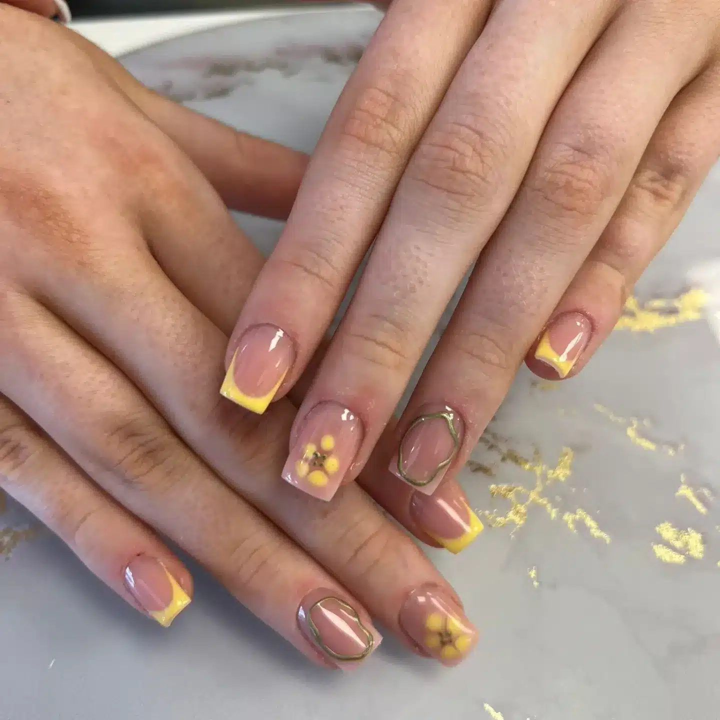 7. Short Yellow French Tip Nails with Daisy Art - yellow french tip nail ideas