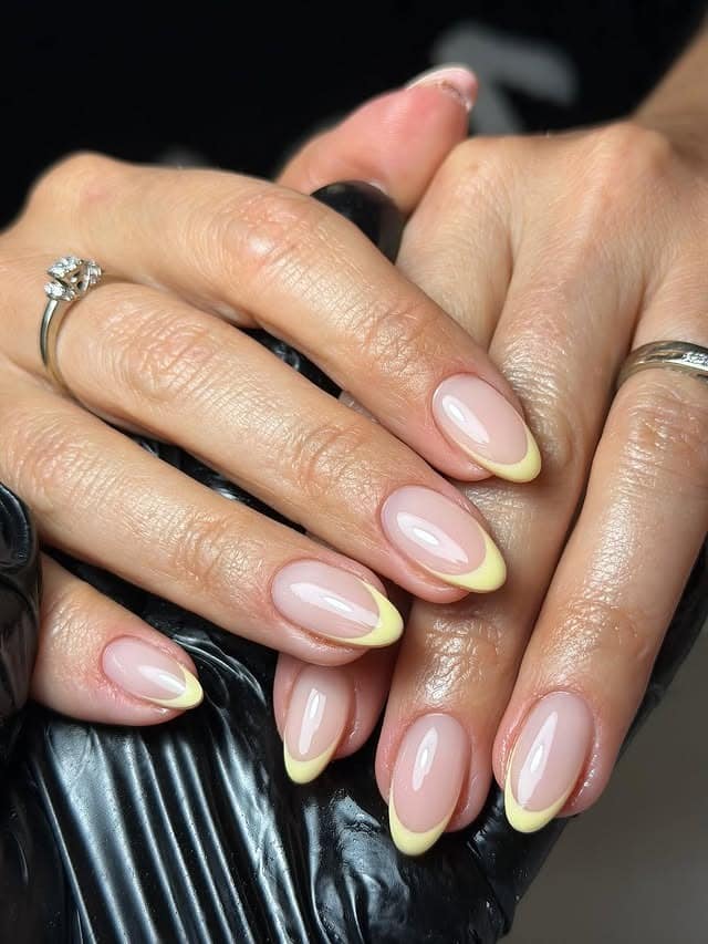 12. Classic Butter Yellow French Tip Almond Nails - yellow french tip nail ideas
