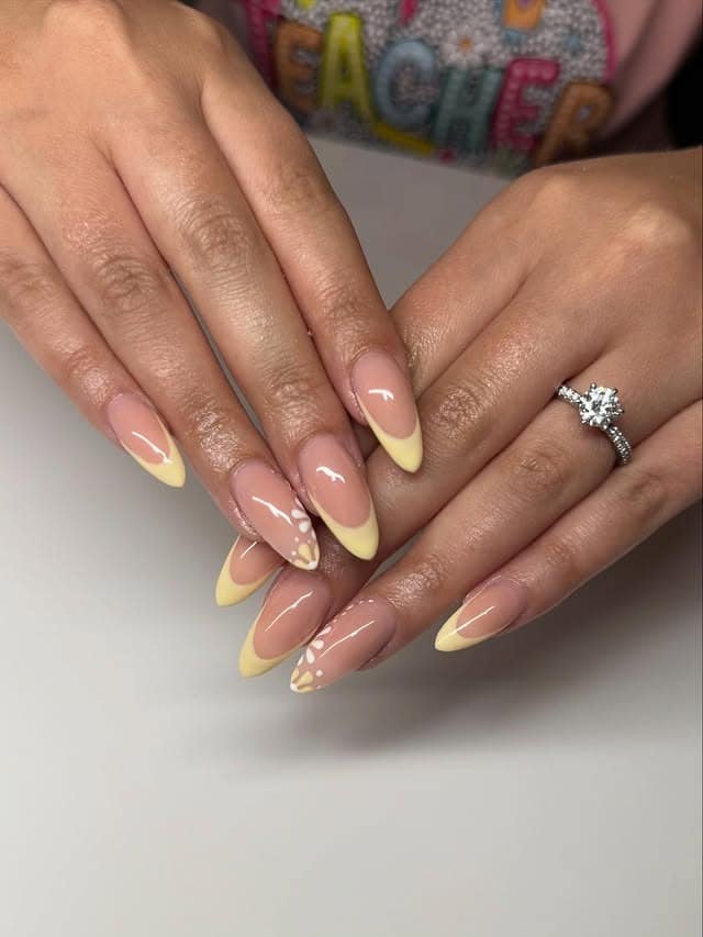 15. Soft Yellow French Tip Stiletto Nails with Petal Details - yellow french tip nail ideas