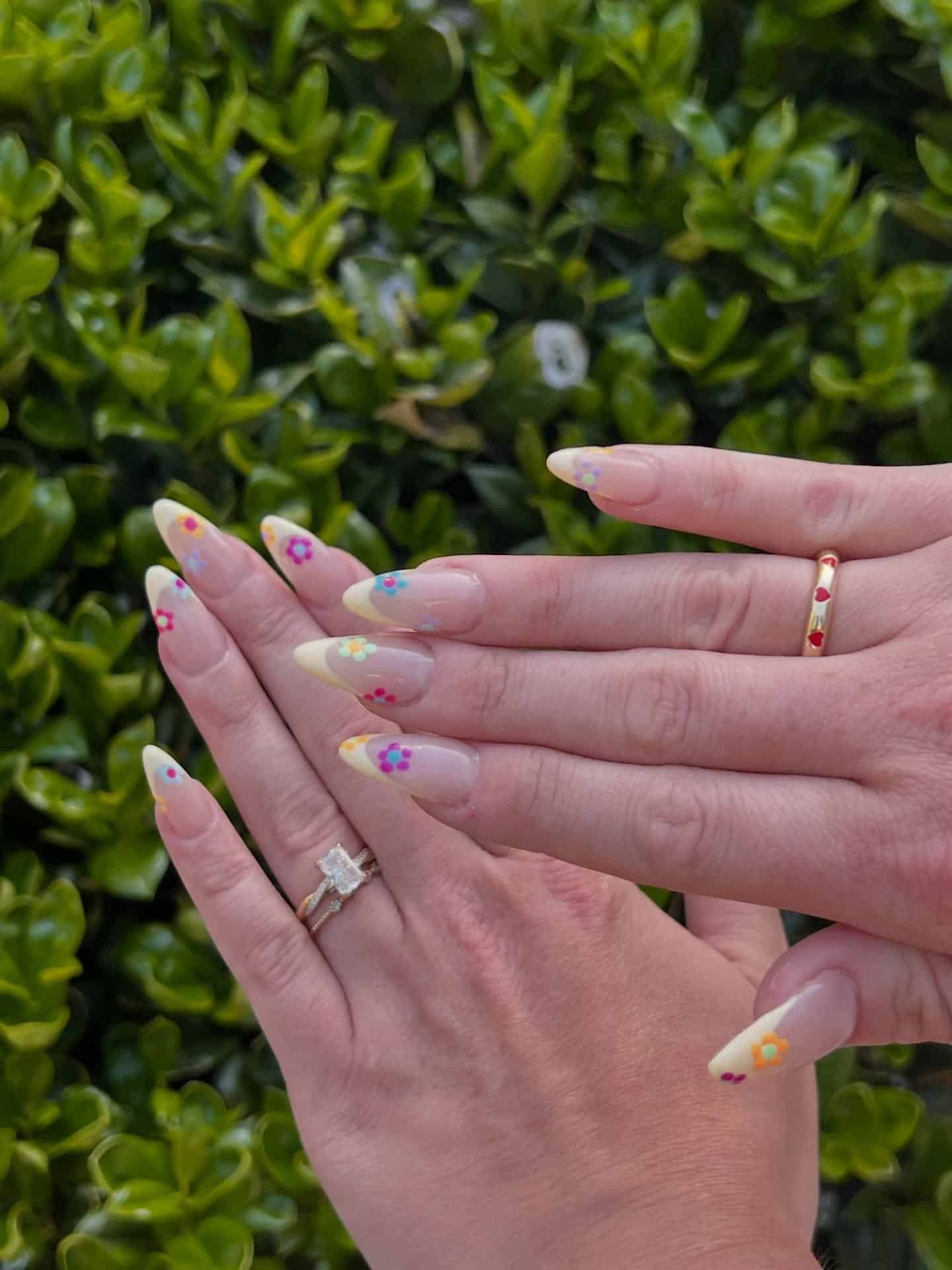 20. Colorful Floral Yellow French Tip Almond Nails - yellow french tip nail ideas