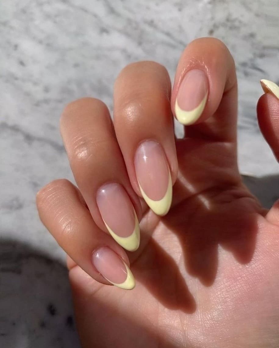 22. Soft Butter Yellow Deep French Tip Almond Nails - yellow french tip nail ideas