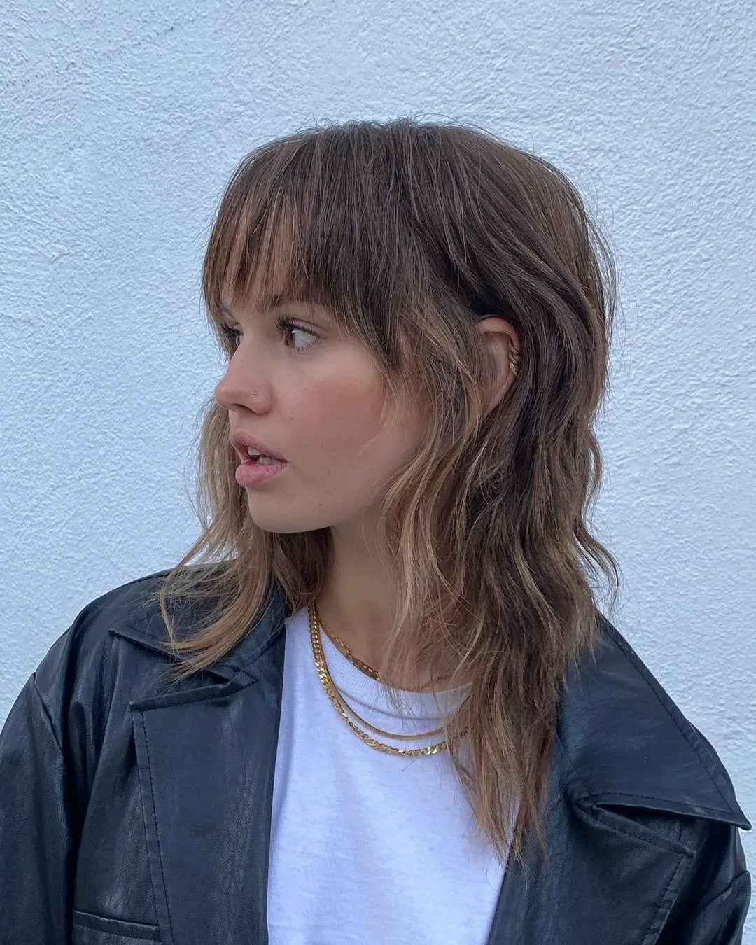 2. Shaggy Brunette Lob with Wispy Bangs - Tousled Hairstyles