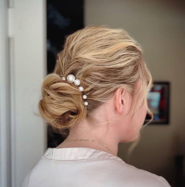 4. Soft Blonde Low Bun - Tousled Hairstyles