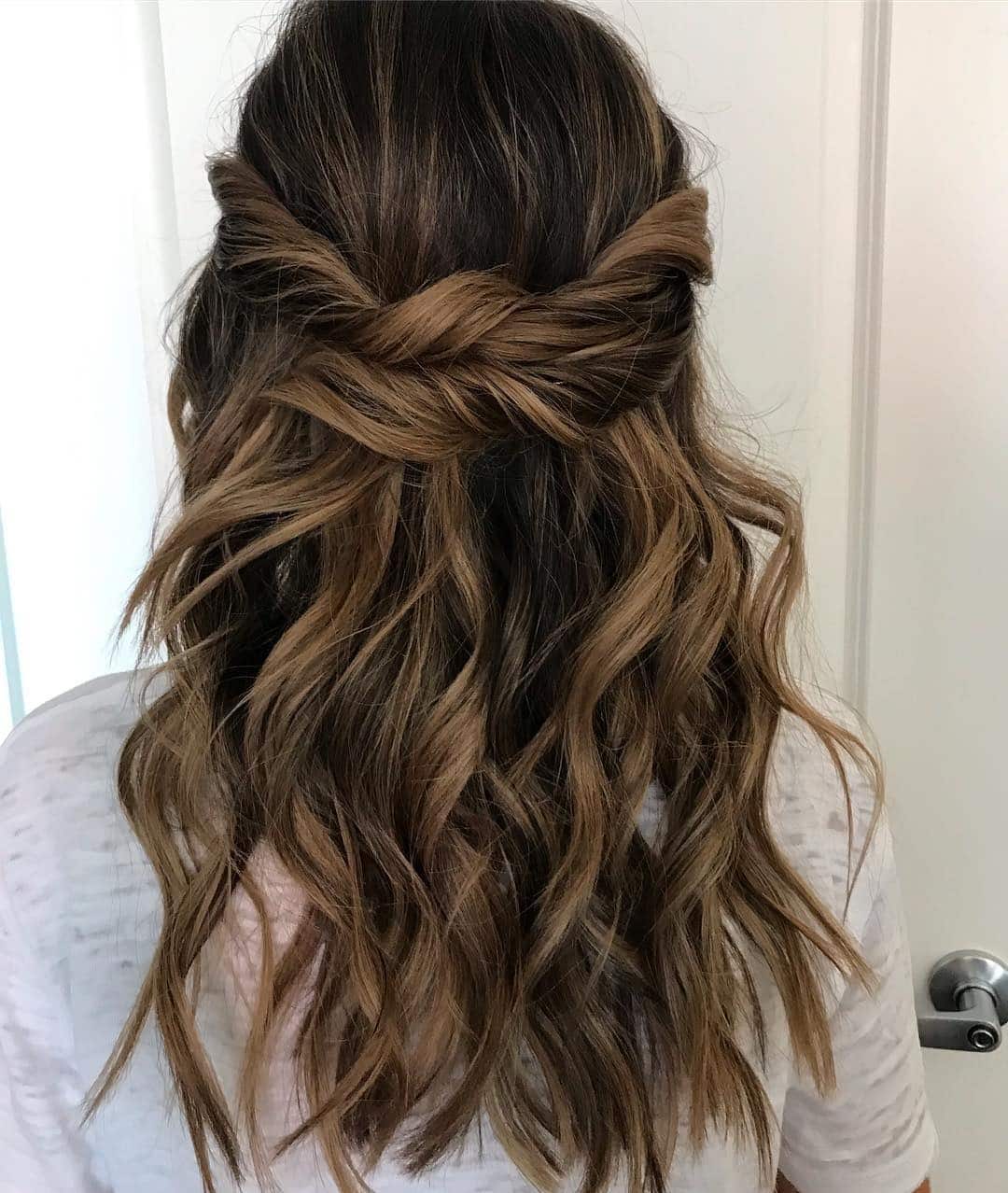 7. Twisted Half-Up Brunette Waves - Tousled Hairstyles