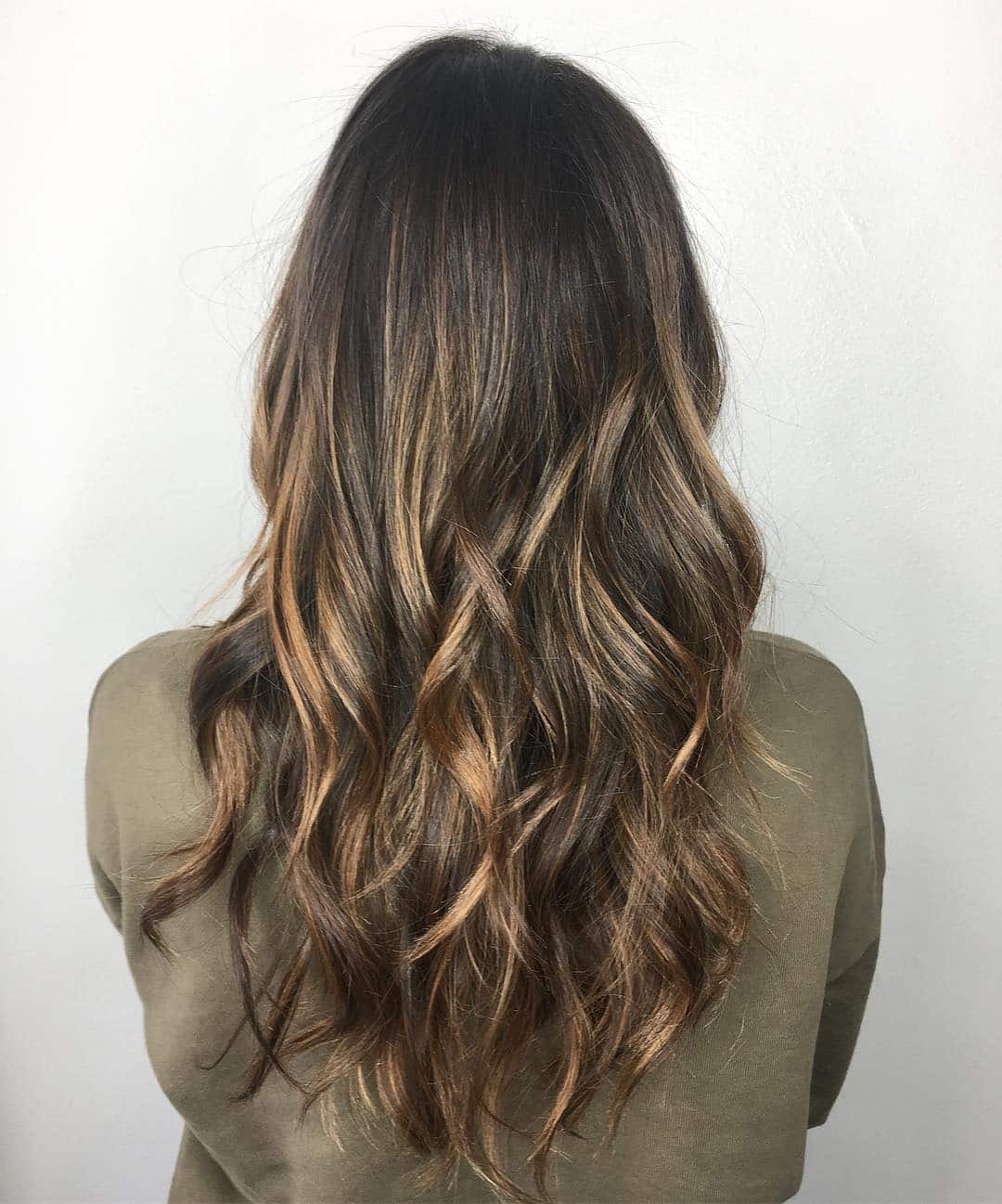 8. Warm Brunette Balayage Waves - Tousled Hairstyles
