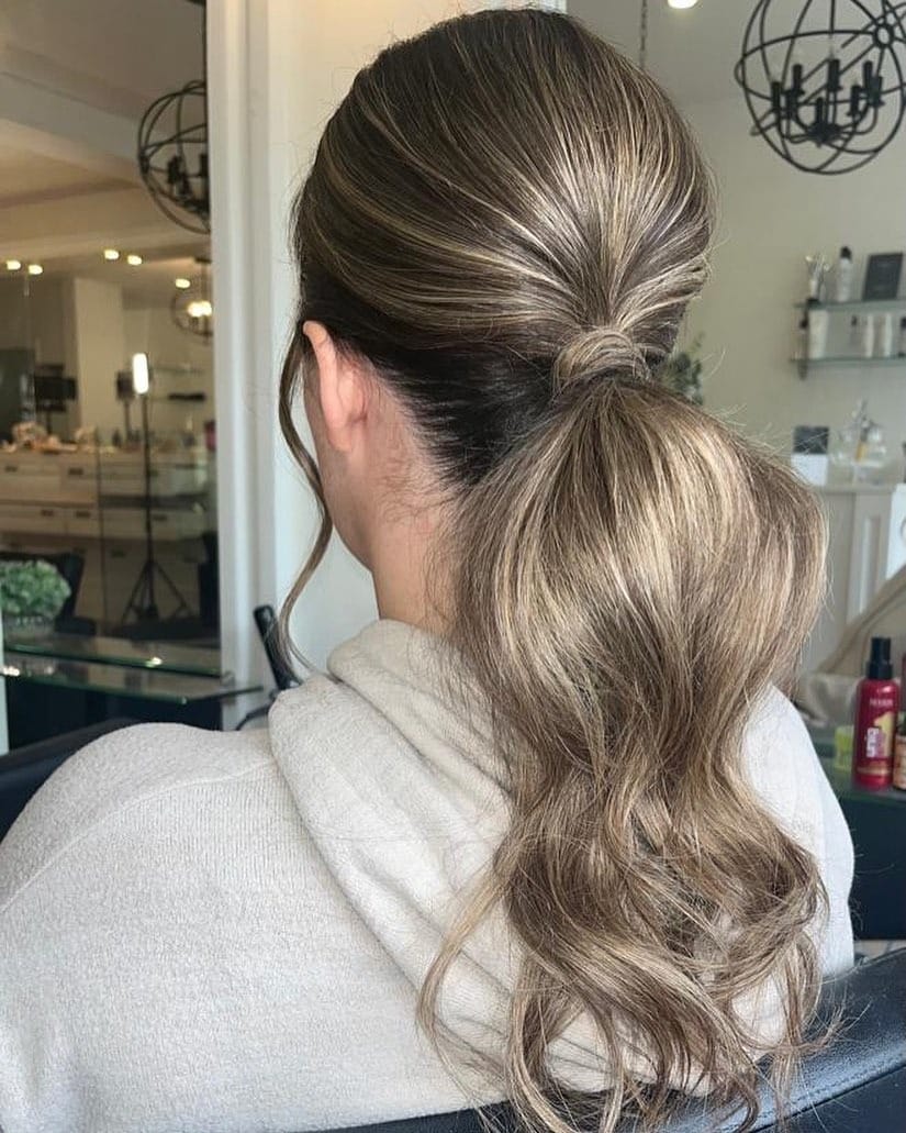 9. Sleek Ash Brown Low Ponytail - Tousled Hairstyles