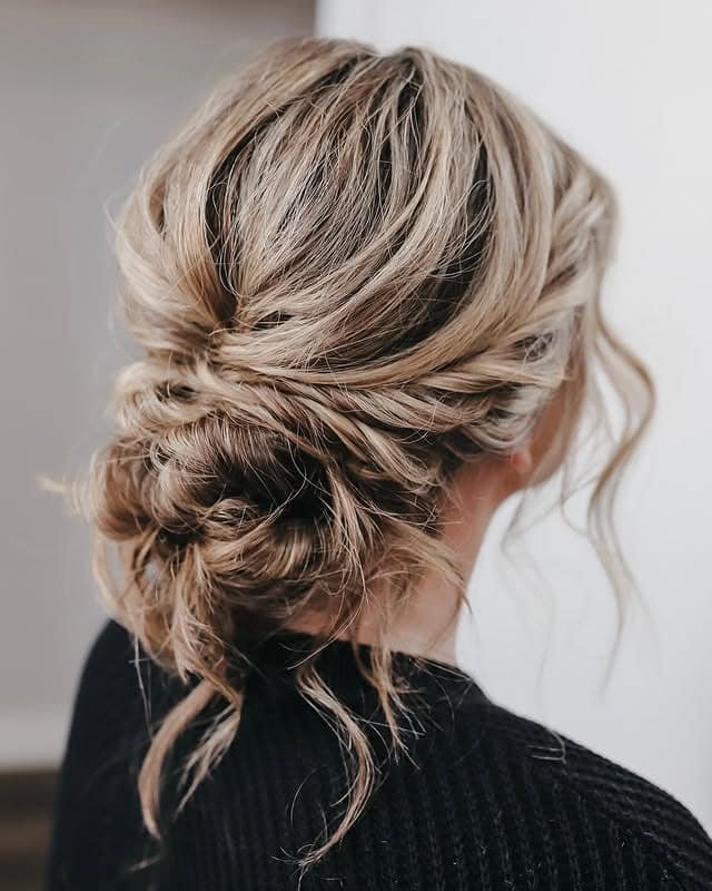 13. Textured Ash Blonde Low Bun - Tousled Hairstyles
