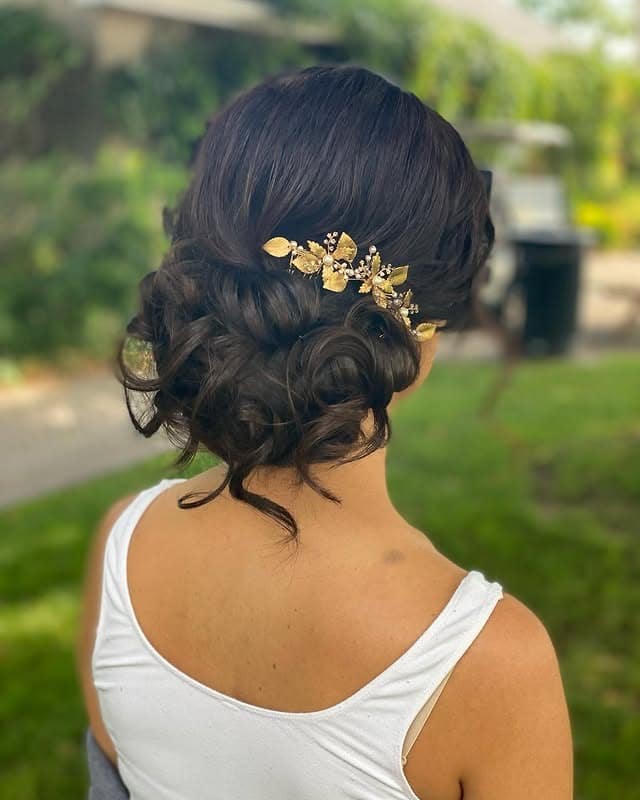 14. Classic Dark Brunette Chignon - Tousled Hairstyles