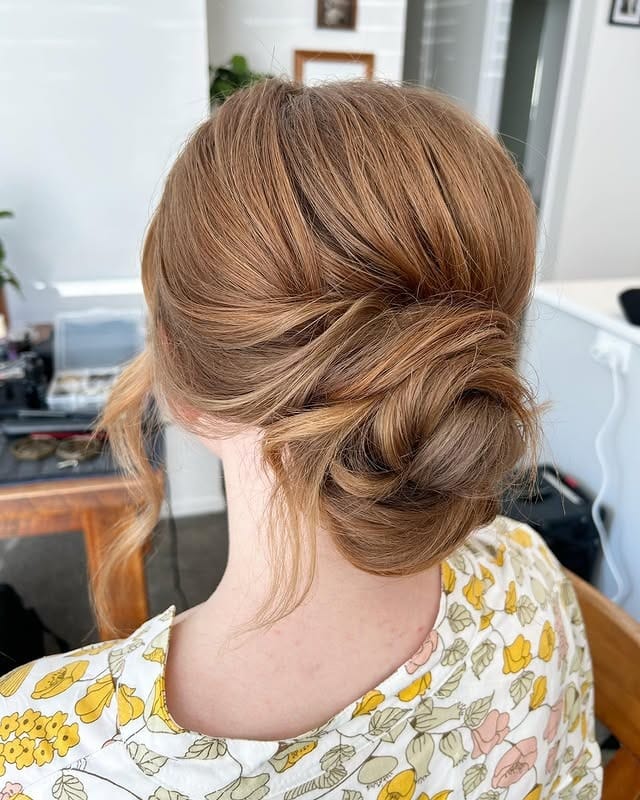 15. Soft Copper Blonde Twisted Bun - Tousled Hairstyles