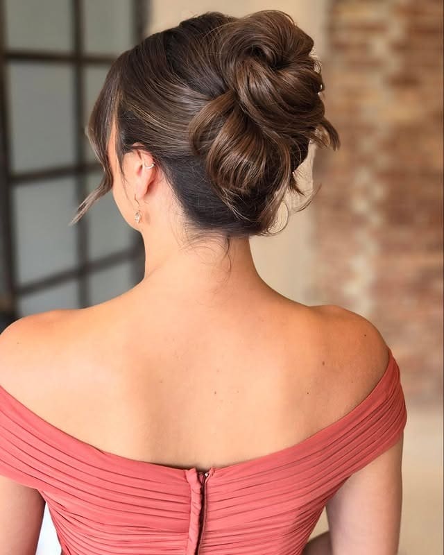 18. Voluminous Chocolate Brown Updo - Tousled Hairstyles