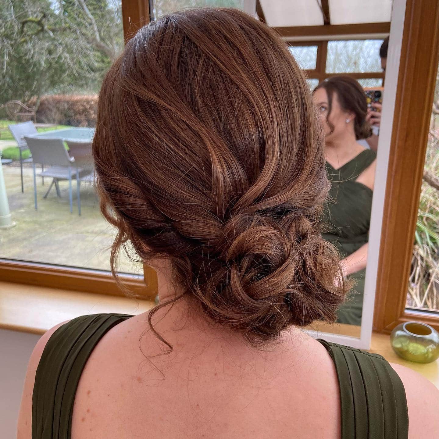 19. Chestnut Brown Textured Low Bun - Tousled Hairstyles